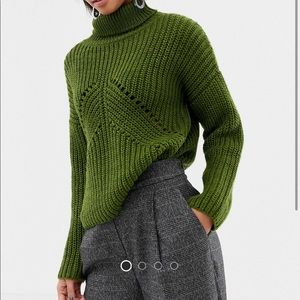 ASOS DESIGN Roll neck sweater in moving rib stitch.